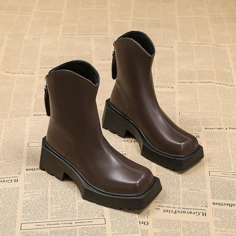 Black platform Martin boots for women with a square toe, back zipper, and a high heel.