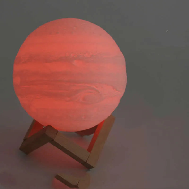 3D printed white moon lamp on a wooden stand with touch-control ring at base