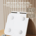 White professional 8-electrode body fat scale with tempered glass platform and LED display.