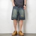 Men's blue retro loose hole denim shorts with a straight leg cut on a neutral background.
