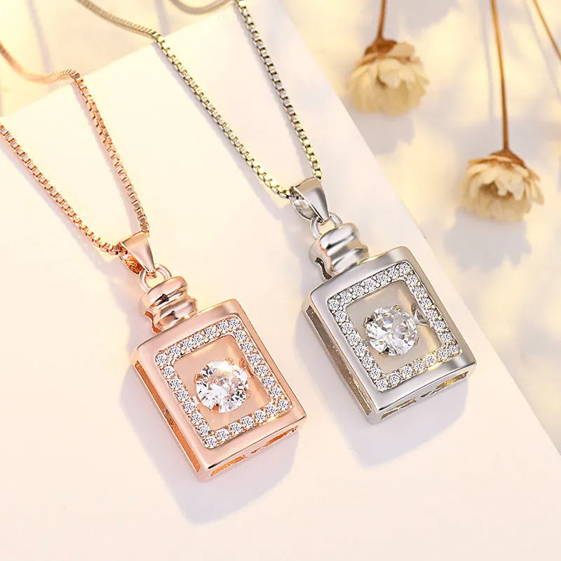 Silver heart-shaped necklace with crown and bow pendant on 45cm chain