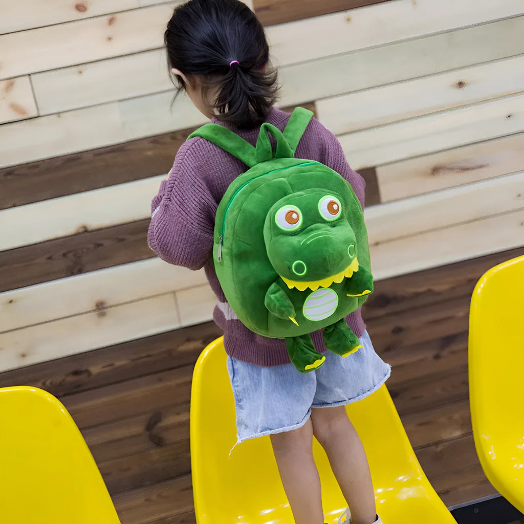 Blue dinosaur plush backpack for children with embroidery detail and soft handle