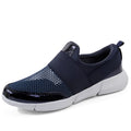 Women's low-top casual sneaker in grey with breathable mesh upper and lightweight sole.