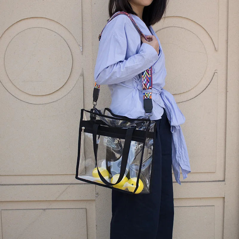 Transparent clear PVC women's messenger bag with double shoulder straps, shown in a brown front bag colour variant.