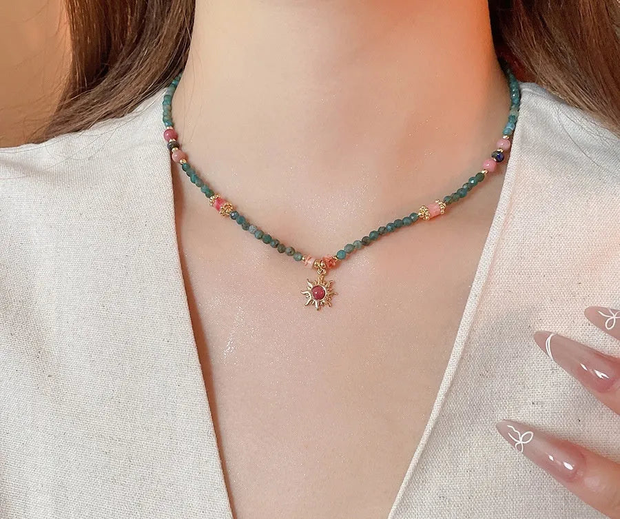 Freshwater pearl necklace with a geometry-shaped stone sun pendant on an electroplated chain.