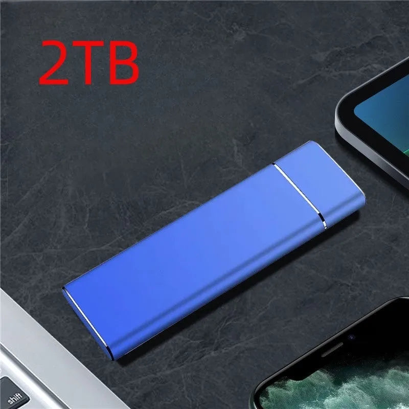 Sapphire blue metal external hard drive with USB cable on a white surface.