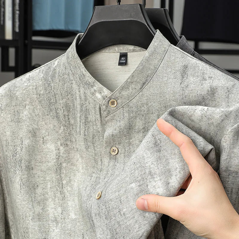Men's loose grey cardigan shirt with stand collar and short sleeves on a hanger