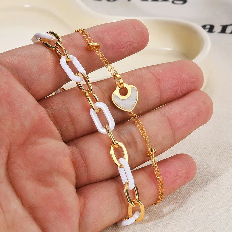 Women's stainless steel resin bracelet with double-layer heart design and electroplated metallic finish