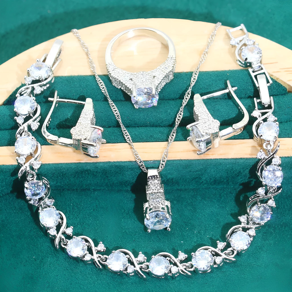 Four-piece bridal jewellery set with zircon alloy necklace, earrings, bracelet, and ring in water wave chain design