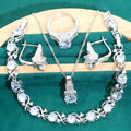 Four-piece bridal jewellery set with zircon alloy necklace, earrings, bracelet, and ring in water wave chain design