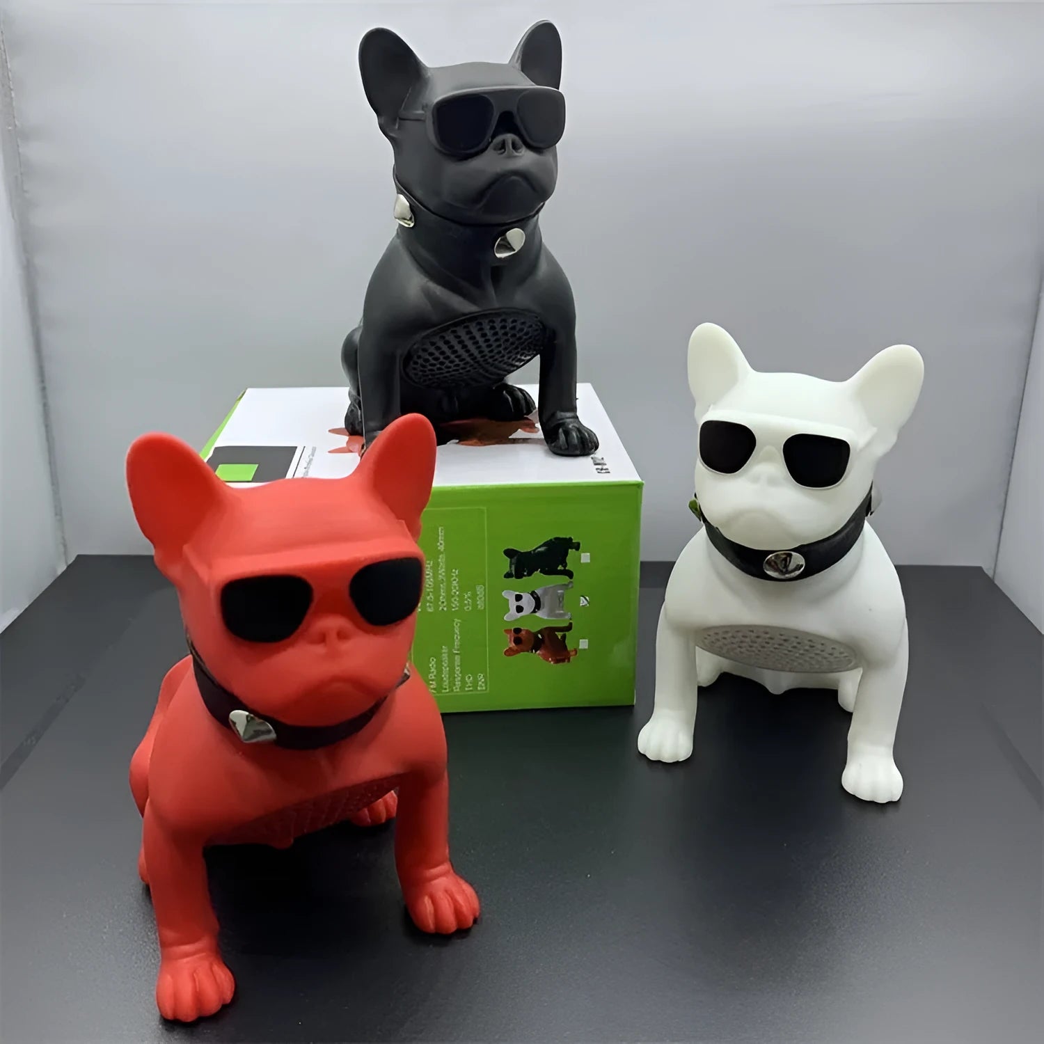 Mini bulldog-shaped Bluetooth speaker in black, red, or white colours showing wireless design