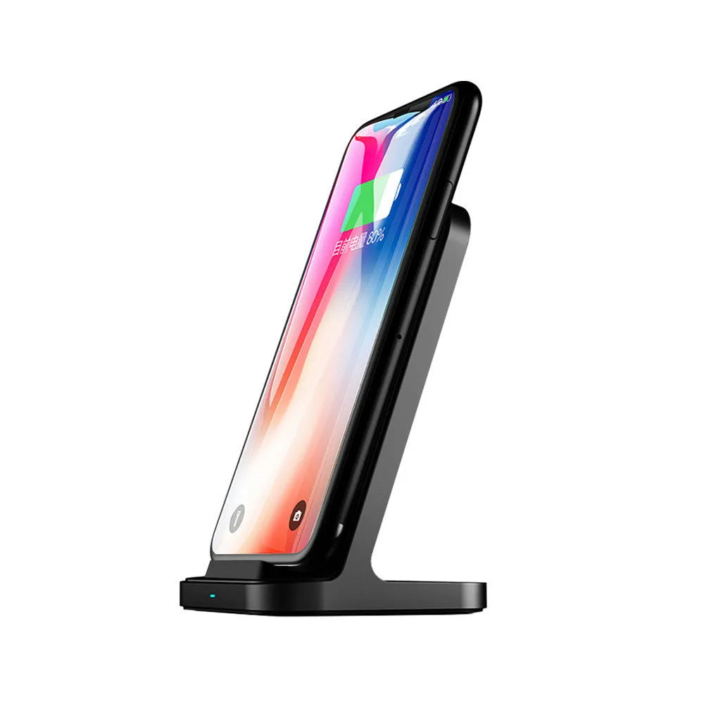 Dark grey vertical wireless charging stand for smartphones on desktop