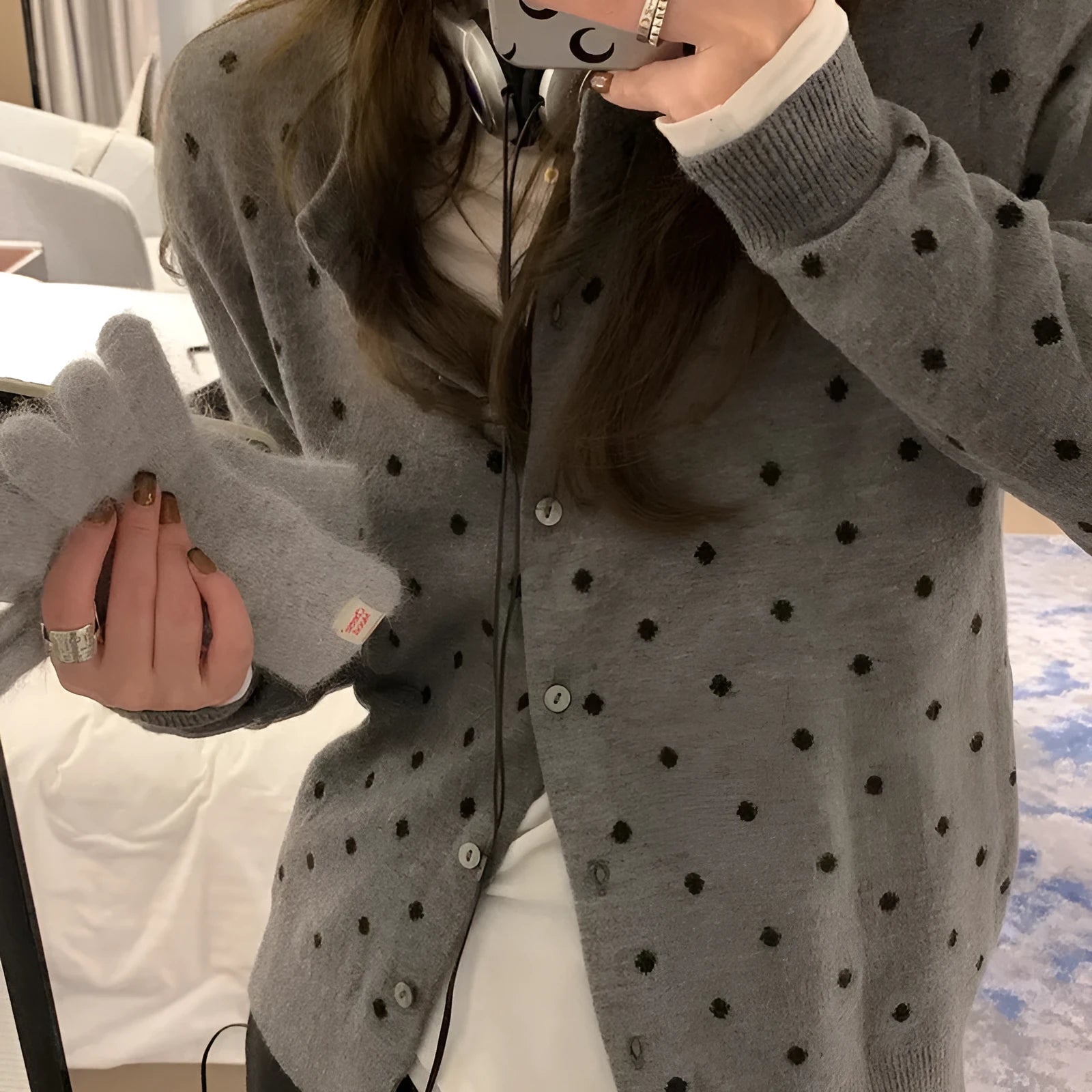 Women's grey dot knitted cardigan with crocheted flower detailing and long sleeves