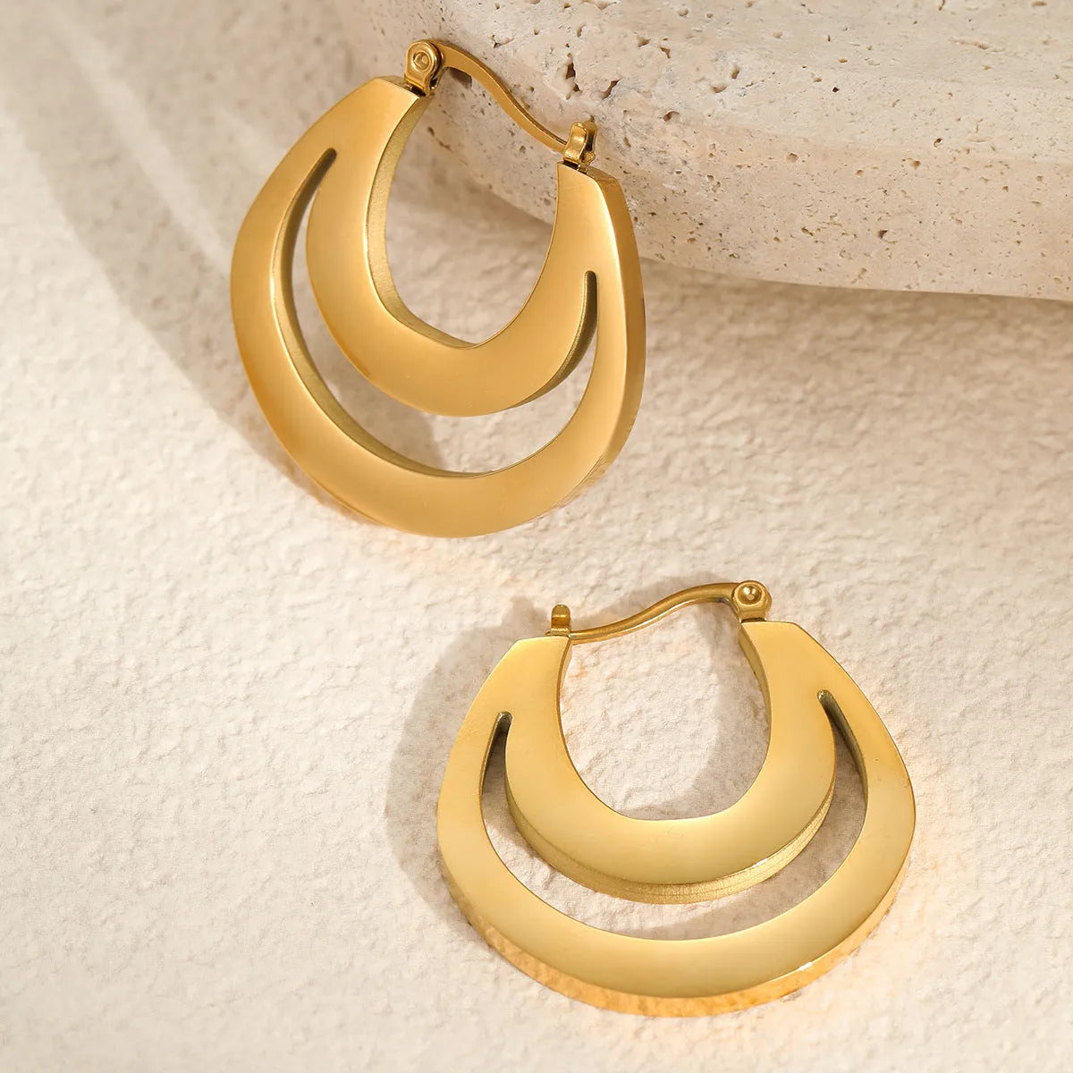 Geometric French earrings with 18K gold plating on stainless steel featuring round ring elements