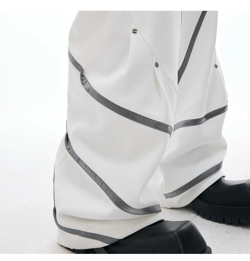 Men's polyester trousers with three-dimensional cutting, metal striped rivets, and pleated design