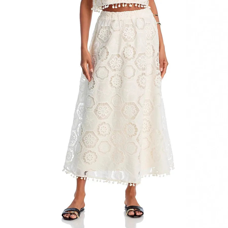 White women's sleeveless top and long embroidered skirt two-piece suit