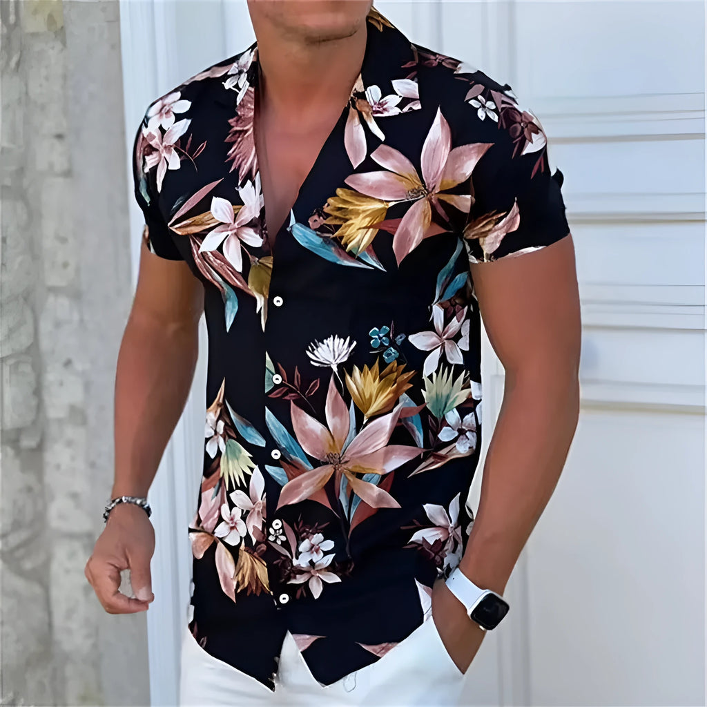 Man wearing a loose fit short sleeve floral print shirt in a cardigan style for summer.