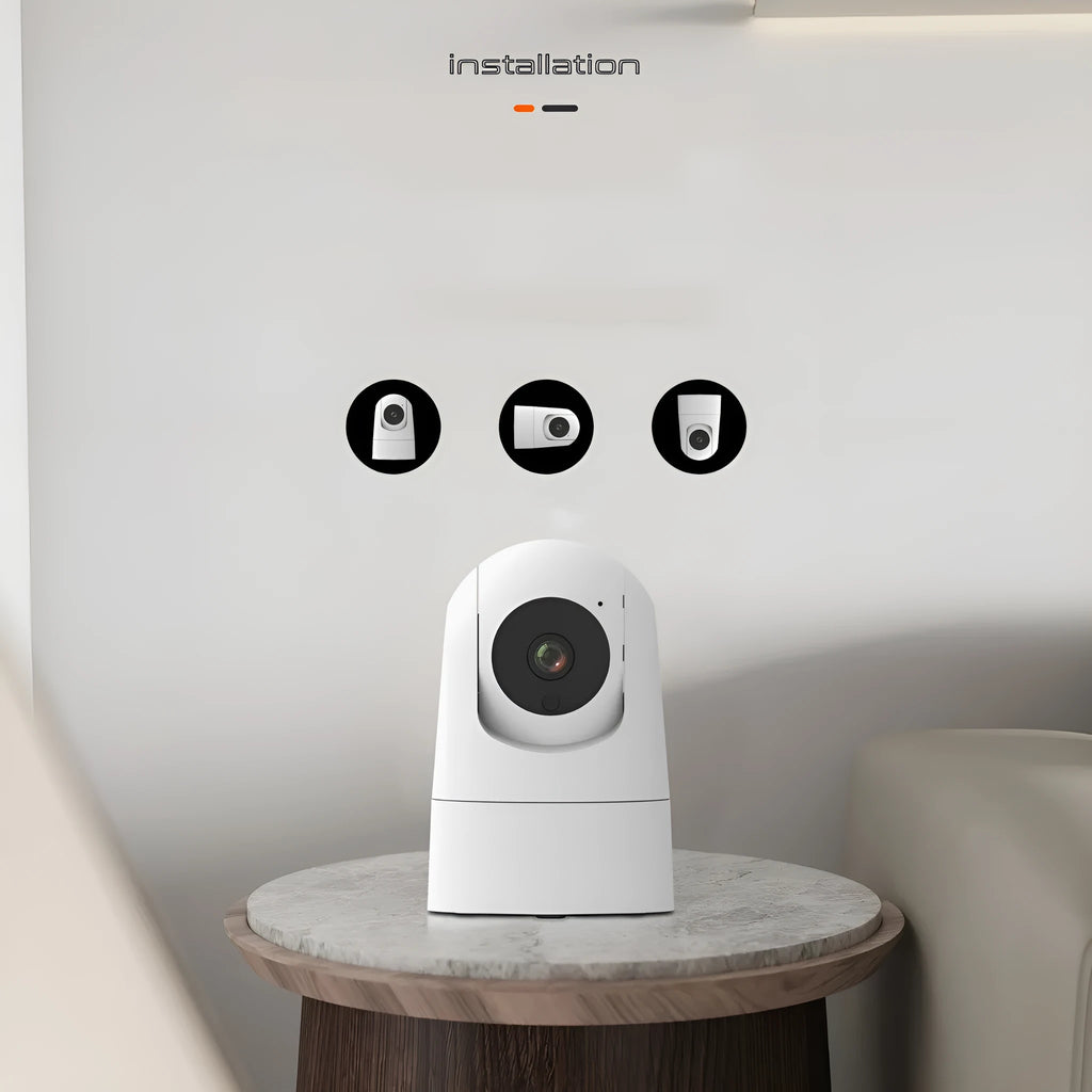 White indoor security camera with pan/tilt mechanism on stand showing front lens and microphone