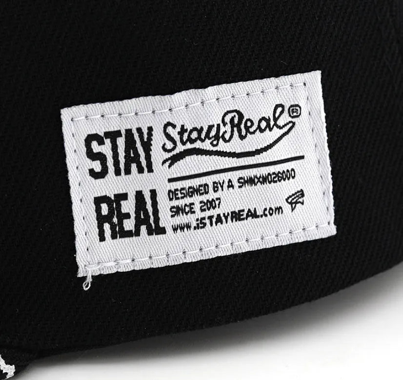 Cotton baseball cap with embroidered letters, adjustable strap, in black or white