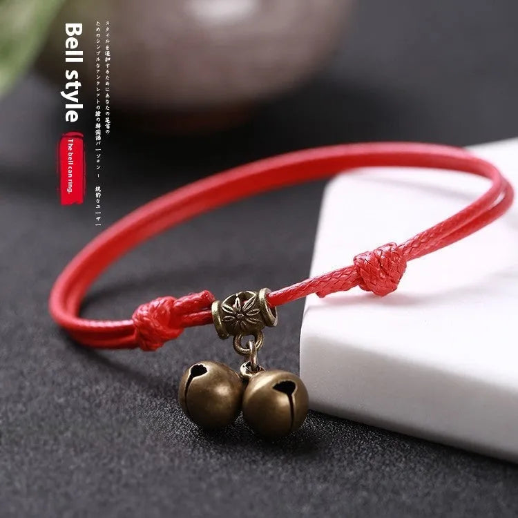 Small adjustable nylon dog collar with brass bell in black, red, or coffee colours