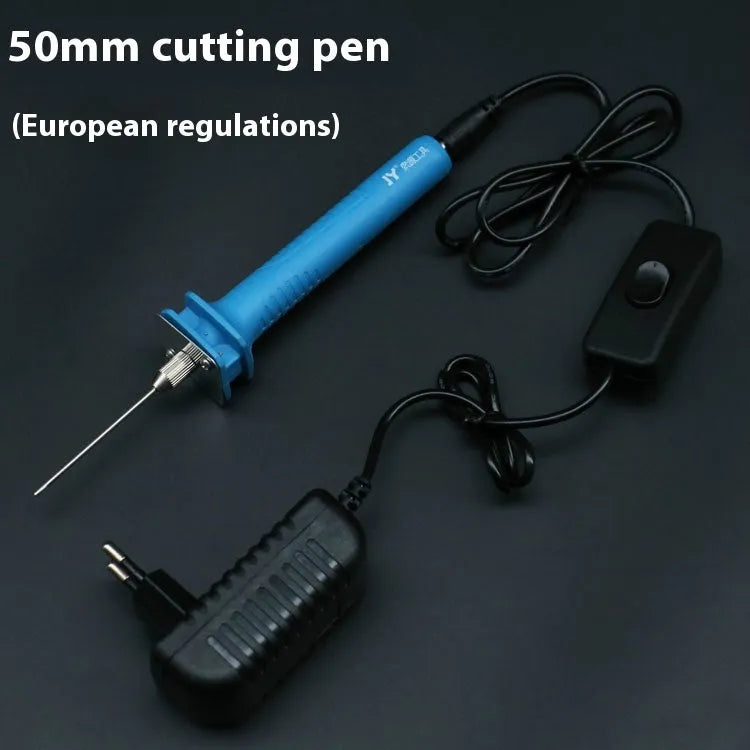 Blue electric heating cutter pen for foam and pearl cotton with power adapter on a work surface.