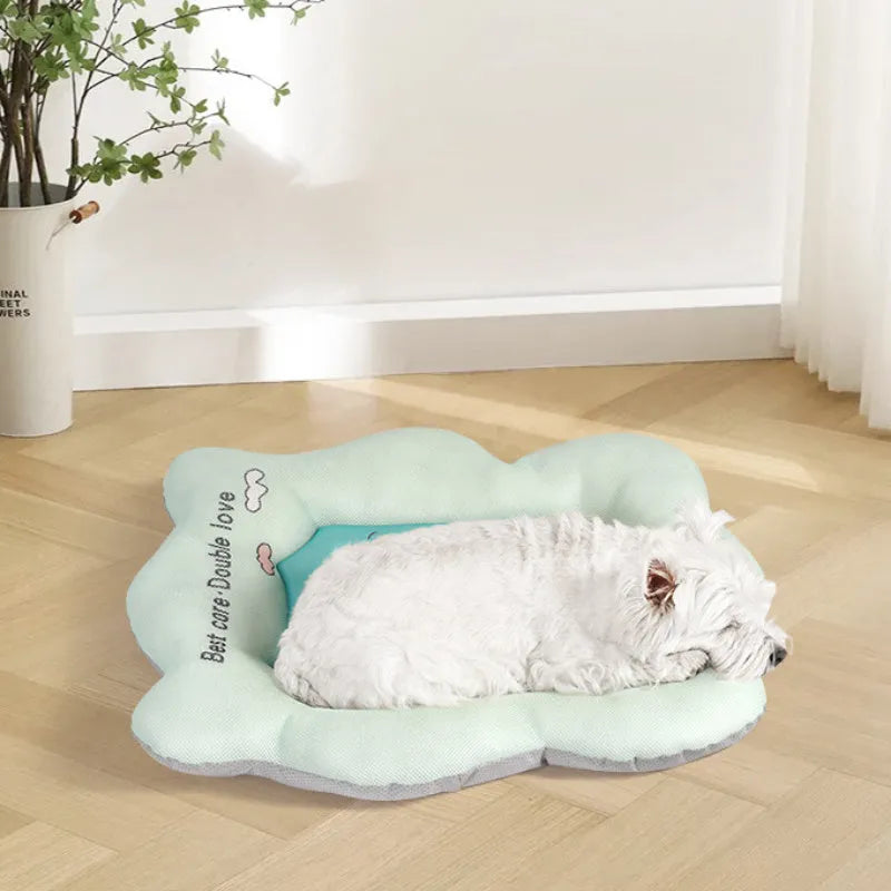 Green pet cooling mat for dogs and cats on a wooden floor.