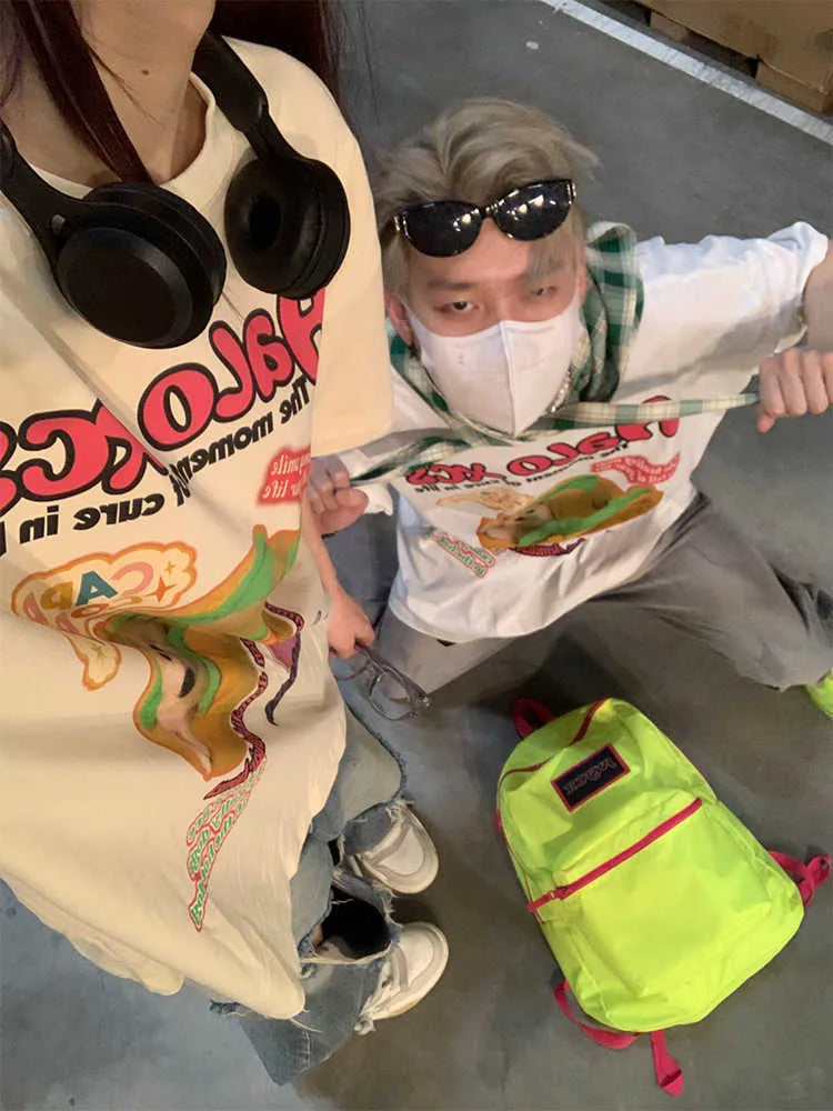Cartoon hamburger dog printed short-sleeved cotton t-shirt in loose fit, shown in apricot colour.
