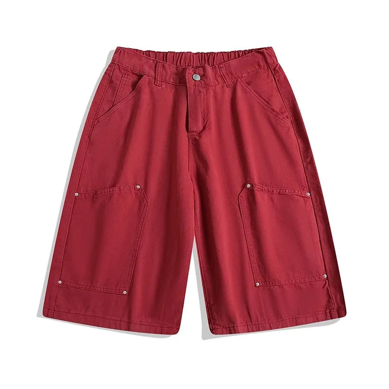 Casual apricot wide-leg cropped shorts with rivet details on a mid elastic waist