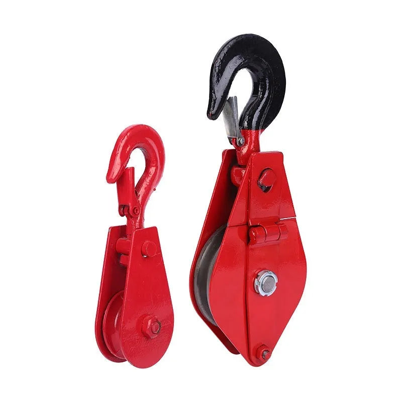 Red industrial steel lifting pulley with a forged hook and safety latch for wire rope.