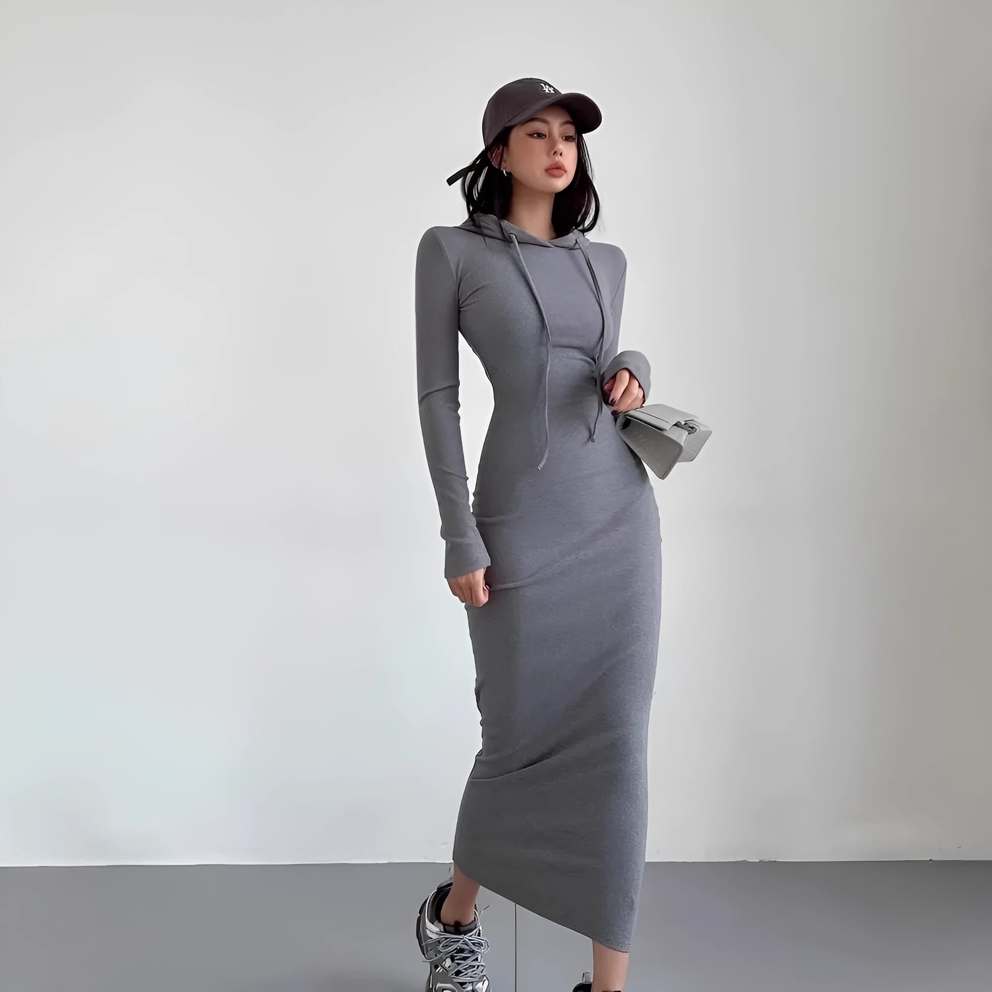 Women's light grey hooded long sleeve sheath dress with high waist on a model