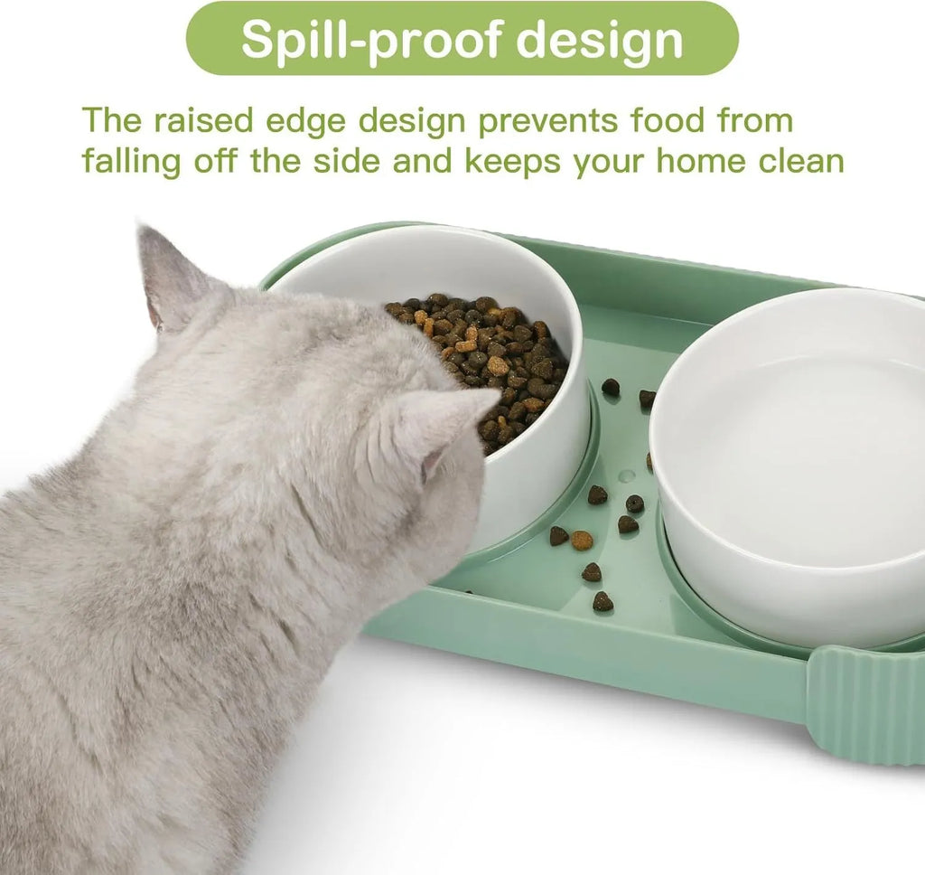 Green ceramic raised cat bowl set with two tilted bowls on a non-slip base