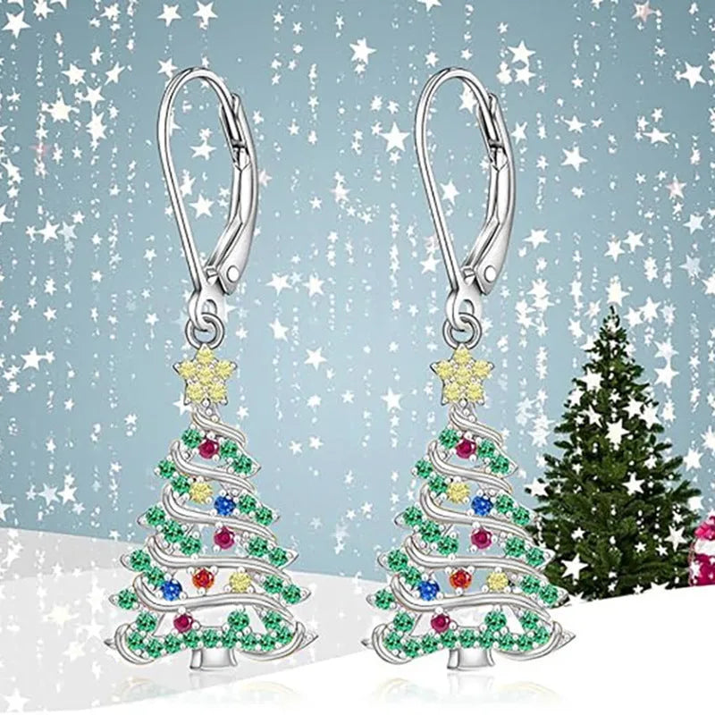 A pair of women's Christmas tree earrings with a star pendant shape in a white gold colour finish.