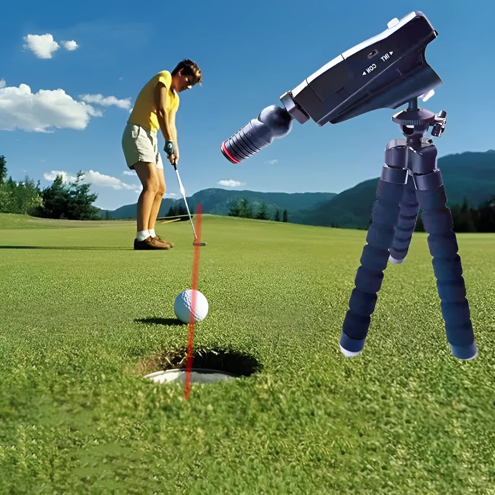 Golf putter laser aiming instrument attached to putter shaft showing projected alignment line on green