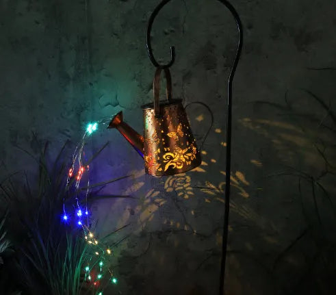 Solar garden lamp with tapered butterfly iron lantern design in warm white LED illumination