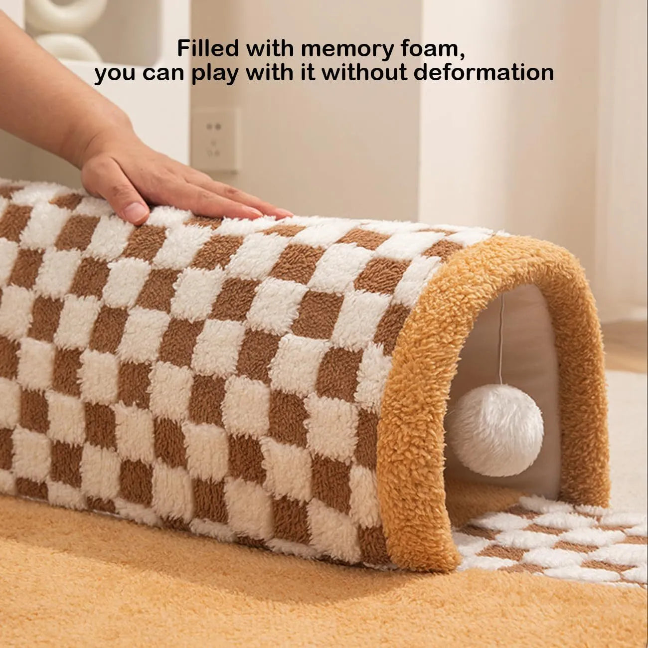 Fan-shaped plush pet bed with central play tunnel in plaid design, shown in coffee colour.