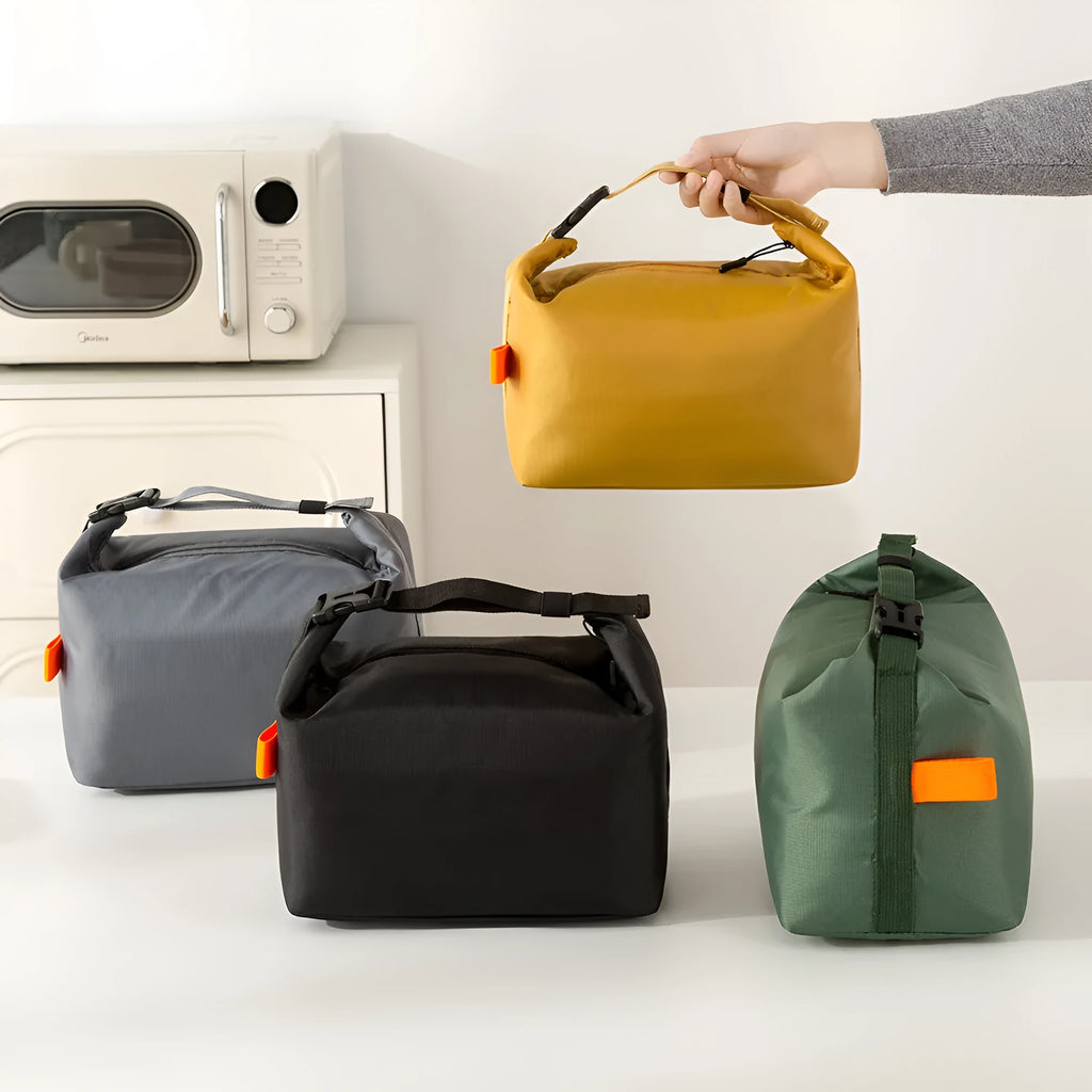 Japanese style insulated lunch bag in Oxford cloth with wide opening for food storage.