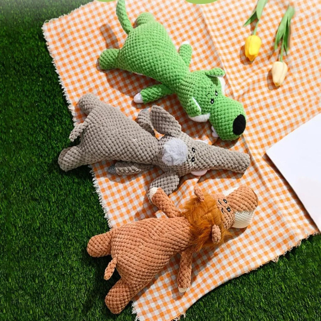 Corn kernel shaped plush dog toy with textured surface for teeth cleaning, available in green, grey, and yellow colours