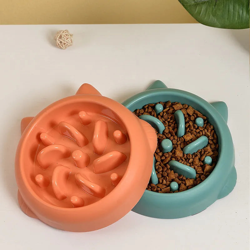 Green bone-shaped slow feeder bowl for dogs with raised maze pattern inside