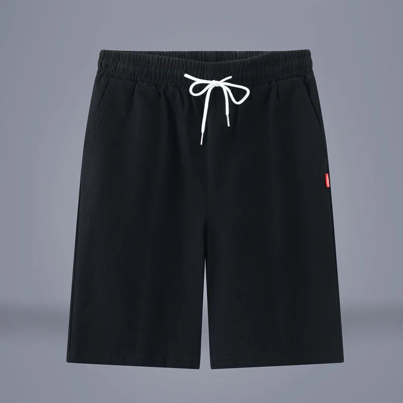 Solid colour cotton linen cropped pants with a drawstring waist on a hanger.