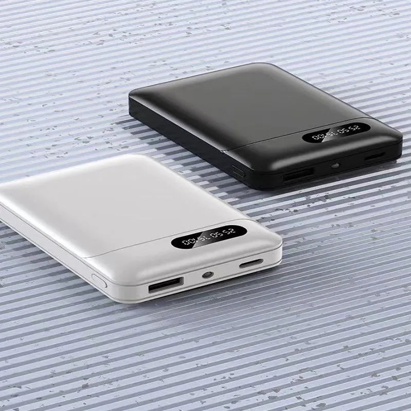 Large capacity portable power bank in black or white with multiple USB charging ports