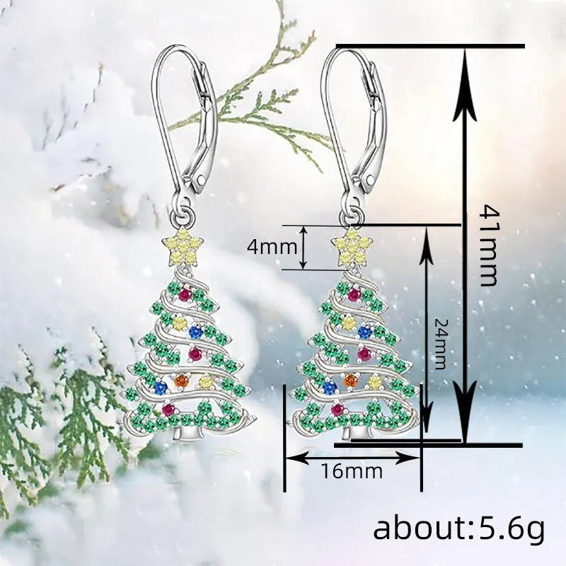 A pair of women's Christmas tree earrings with a star pendant shape in a white gold colour finish.