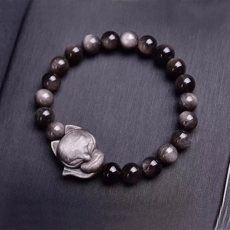 Obsidian bracelet with fox head ring on an adjustable elastic band