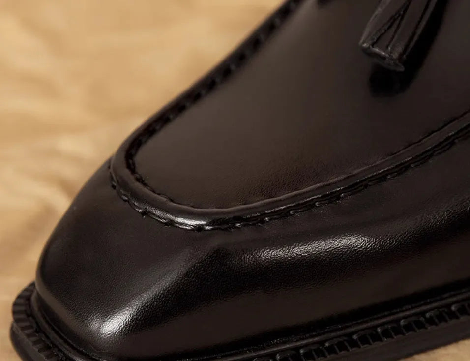 Men's genuine leather slip-on loafers in black and brown with fringed detailing and rubber soles