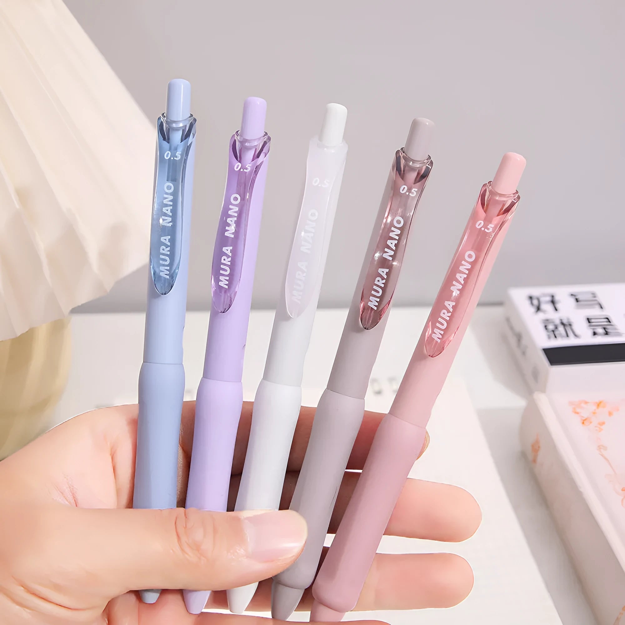 Macaron Colour Press Gel Pen with 0.5mm tip in smoked white, brown, or pink options.