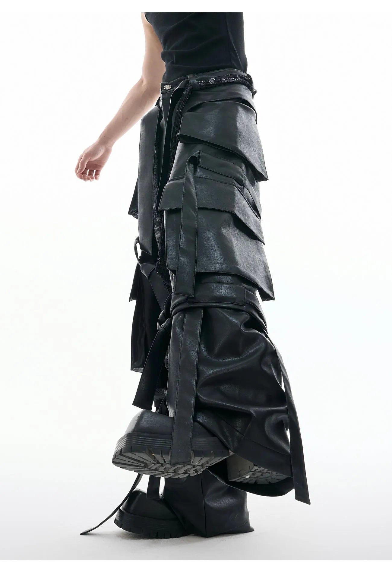 Black loose-fit retro trousers with quilted panels and multi-pocket stitching detail.