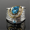 Blue Chinese style zircon ring with drop shape design and inlaid rhinestone detailing on alloy band