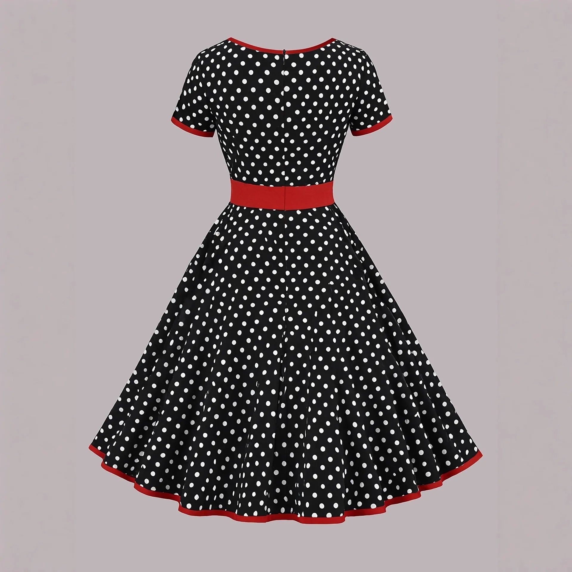 Square collar short sleeve polka dot dress with pleats and a zip on a mid-length skirt.
