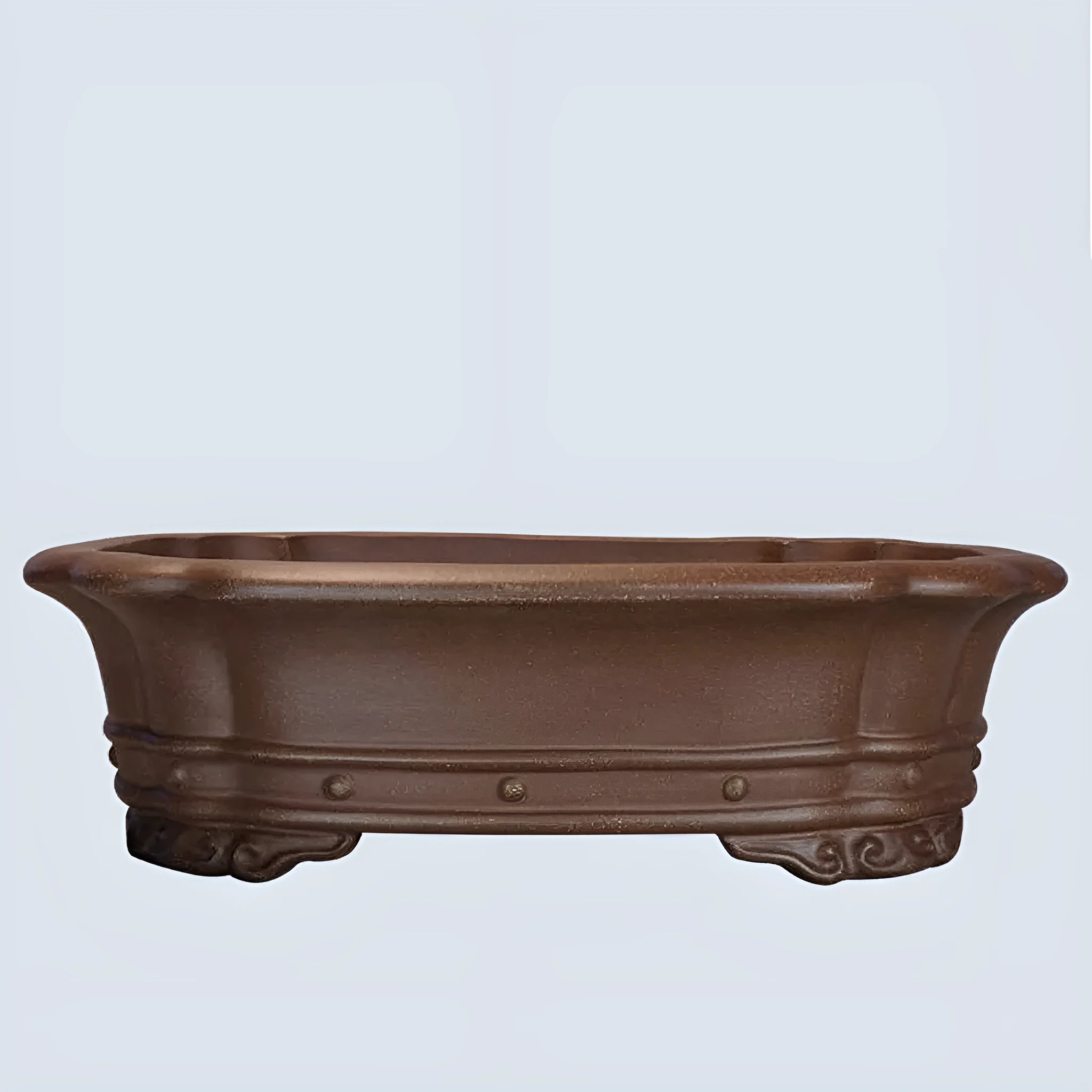 Handmade purple sand rectangular antique flower pot on a desktop.