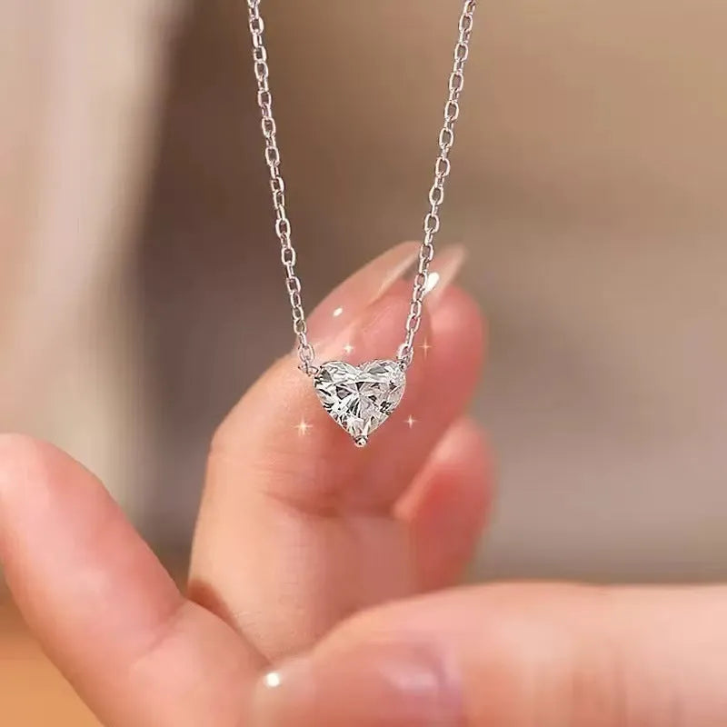 Women's silver necklace with heart-shaped pendant on simple chain