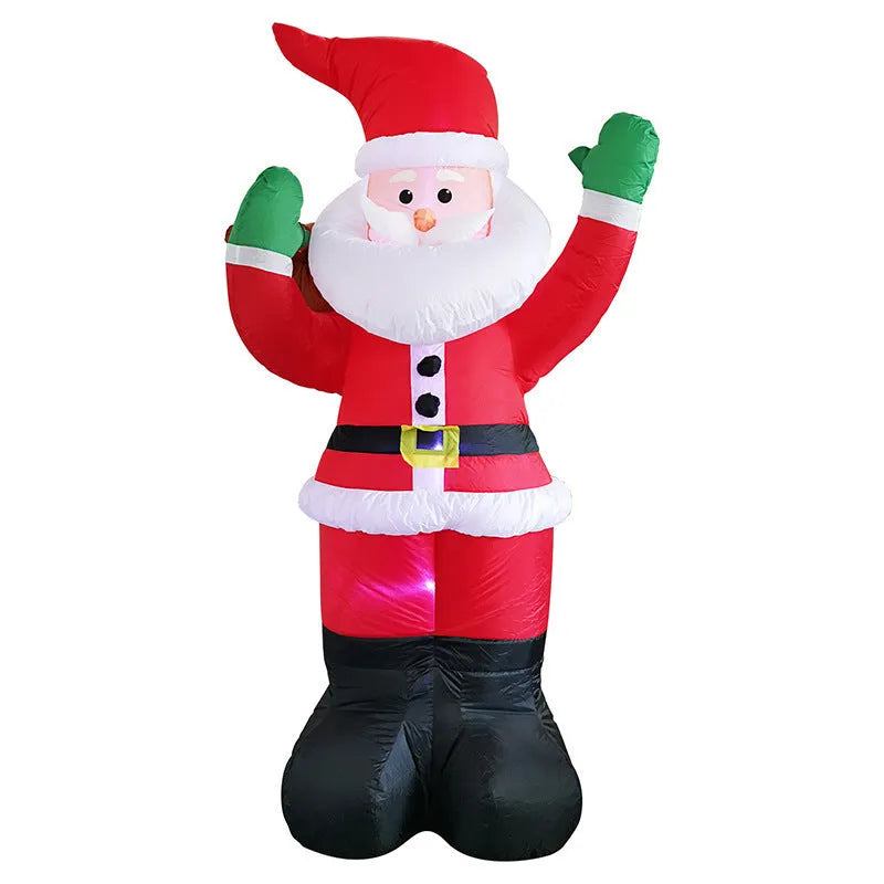 Christmas LED inflatable decoration of a glowing Santa Claus figure in a garden at night